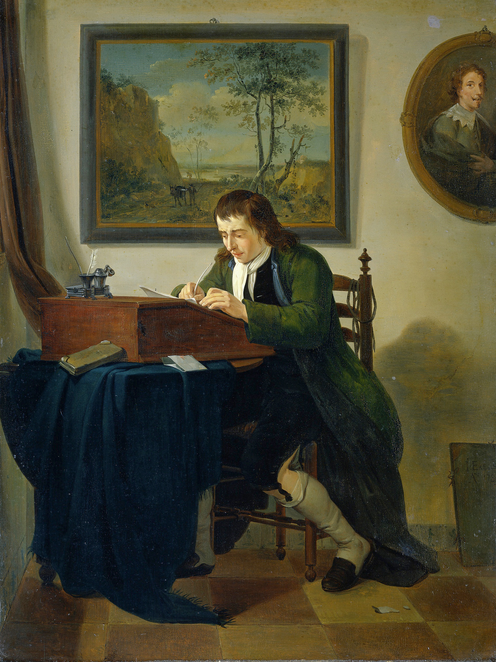 man writing at his desk